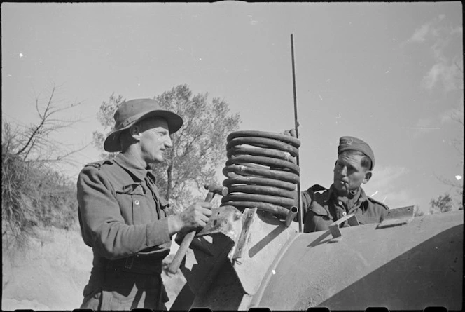 W J Heath and J D Wards constructing mobile shower at NZ Divisional Field Workshops, Cassino area, Italy, World War II - Photograph taken by George Kaye