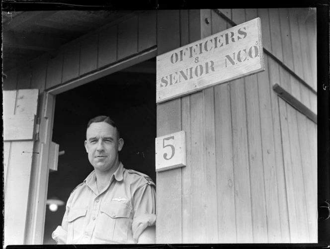 Portrait of Flight Lieutenant M McKenzie outside the Officers & Senior NCO Office No 5, Nausori Airfield, Fiji