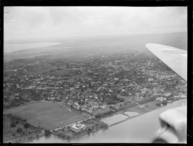 Suva Harbour and Albert Park with rugby fields and the Fijian Parliament Building with Suva beyond, Viti Levu, Fiji