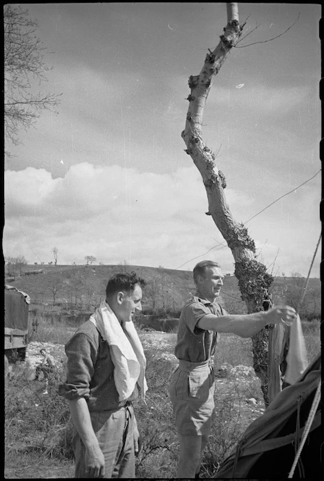 J H Ransome and J B Rodgers attend to their washing on the Italian Front, World War II - Photograph taken by George Kaye