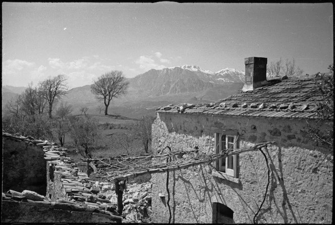 Mountains above the Volturno Valley seen past bombed house on the Italian Front, World War II - Photograph taken by George Kaye