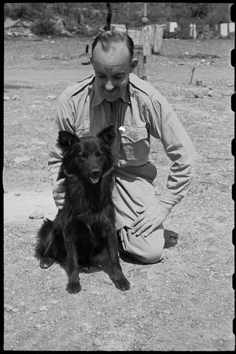 Major F Hutter with Butch, the canine mascot of 6 NZ Field Ambulance, Italy, World War II - Photograph taken by George Bull