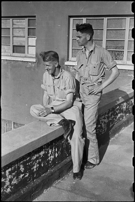 Two New Zealand front-line soldiers watch sports at 200 Rest Camp in Campobasso, Italy, during World War II - Photograph taken by George Bull