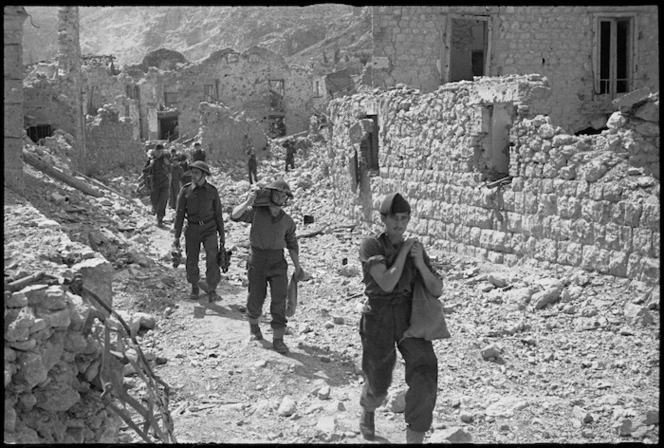 Allied infantry personnel move among ruins of Cassino shortly after the town fell, Italy, World War II - Photograph taken by George Kaye