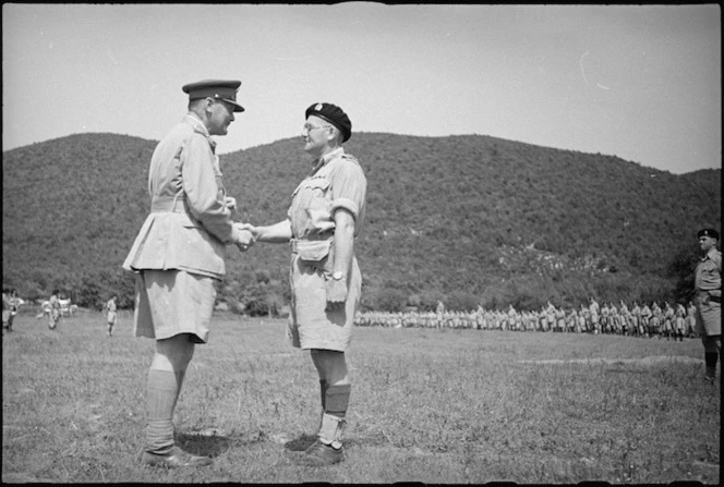 Lieutenant Colonel R L McGaffin congratulated by General Freyberg after receiving DSO at parade in Volturno Valley, Italy, World War II - Photograph taken by George Kaye