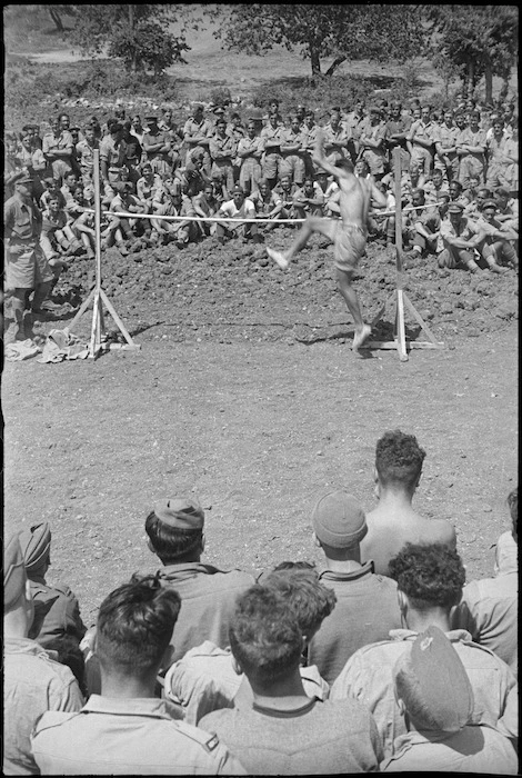 Competitor taking part in the high jump at 5 NZ Infantry Brigade Sports Meeting in Italy, World War II - Photograph taken by George Kaye