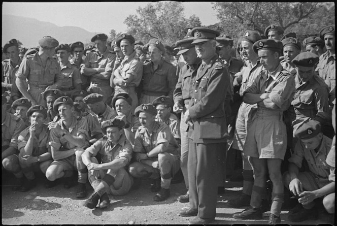 Lieutenant General Puttick, Brigadier Parkinson and troops of 2 NZ Division listening to a speech by Prime Minister Peter Fraser, Cassino area, Italy - Photograph taken by George Bull