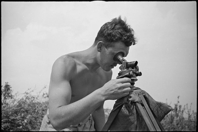 K J Retter using a director in NZ Divisional Artillery action on the Cassino Front, Italy, World War II - Photograph taken by George Kaye