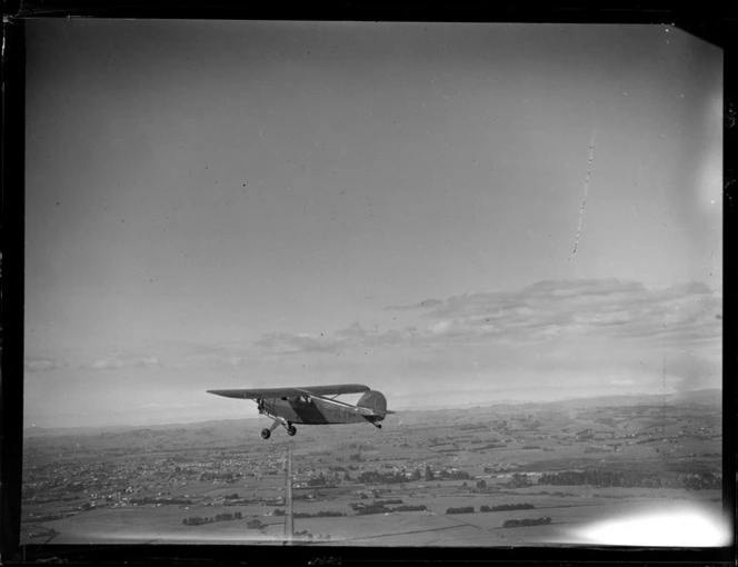 Rearwin Sportster aircraft, ZK-AIP, in flight over Auckland