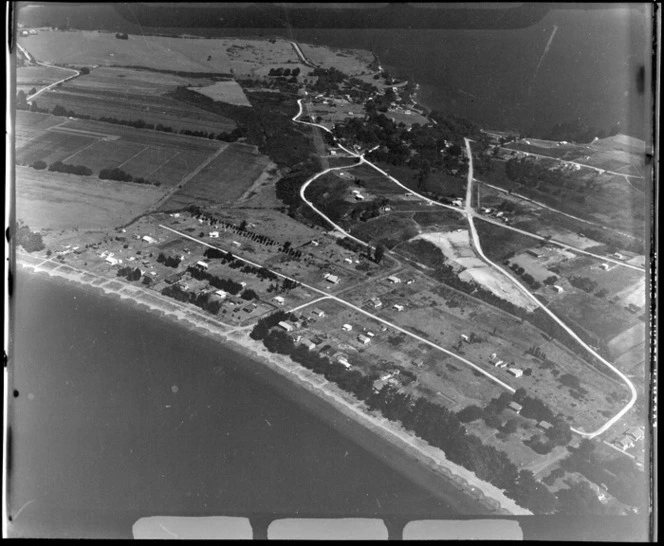 Big Manly Beach residential settlement with Beach Road linking to Little Manly Beach beyond, Whangaparaoa Peninsula, North Auckland