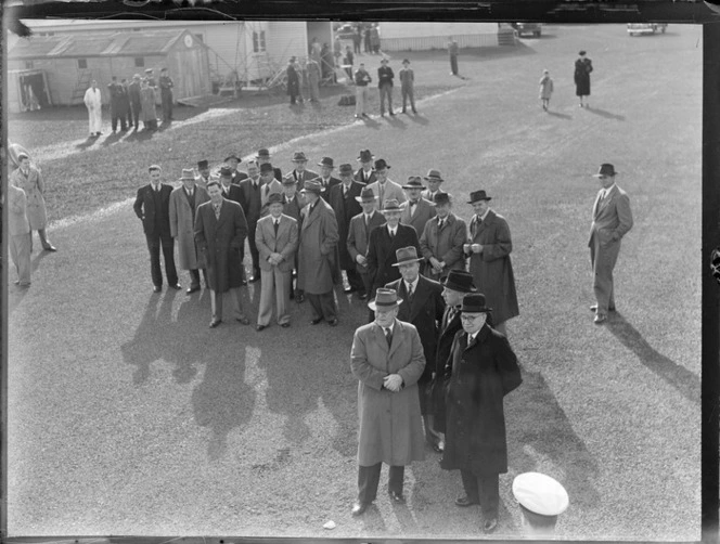 View of unidentified passengers ready to board a Pan American Airways Clipper Class Cathay DC4 passenger plane Good Will Flight, Whenuapai Airfield, Auckland