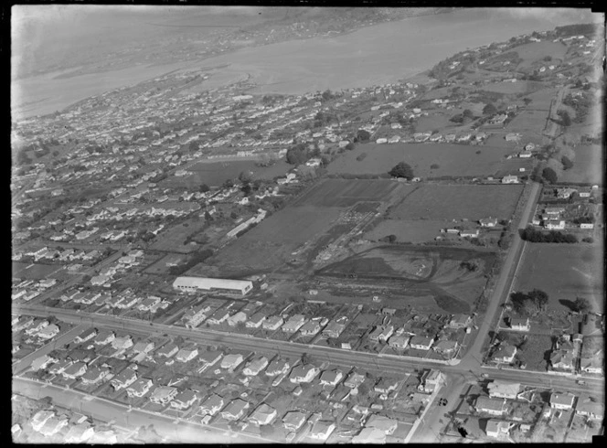 View of the Korma Mills Textile Factory at Royal Oak with Onehunga High School beyond, looking to Mangere, Auckland City