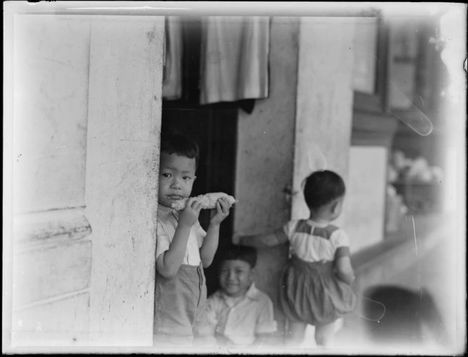 Group of unidentified children at a market, Fiji