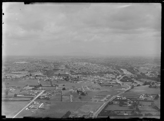 Open fields with Victoria Street in the foreground and the Fairfield Bridge over the Waikato River, looking to Hamilton City and Lake Rotoroa