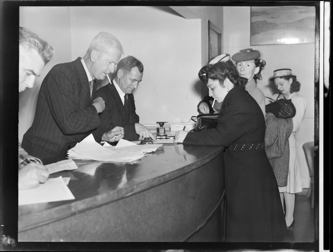 Passengers filling forms at customs, Tasman Empire Airways Ltd, Auckland