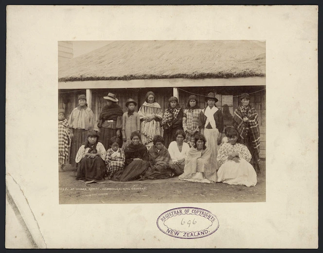 Group of women and children at whare komiti, Haerehuka