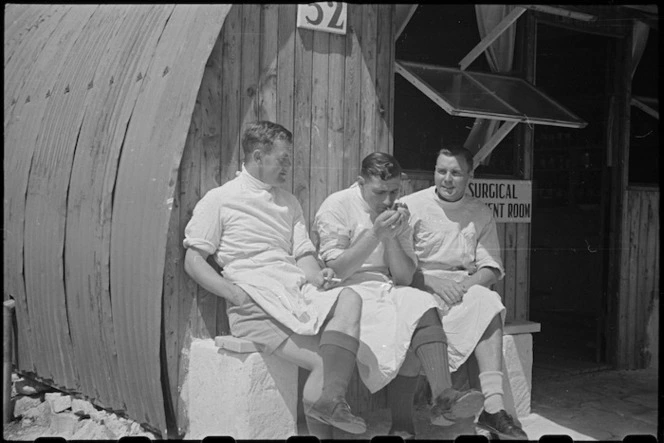 Three medical orderlies wait for Prime Minister's visit at NZ Advance Base Hospital in Italy, World War II - Photograph taken by George Bull