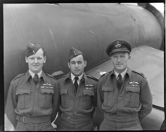 RNZAF group at Ohakea, Whanganui District, showing (L to R), Flight Lieutenants G R B [Highet?], G W Annand and J R Claydon