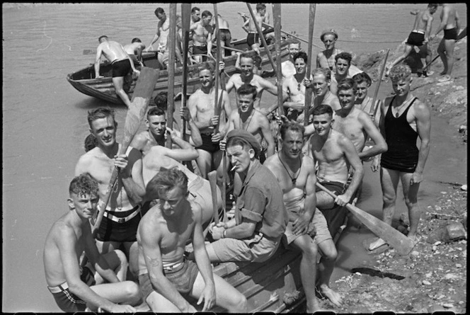 Boat crews waiting to take part in the 'Napoli Nebelwerfer's Nudge' at 24 NZ Battalion's aquatic derby at Arce, Italy, World War II - Photograph taken by George Kaye