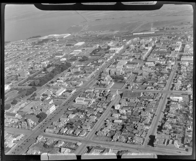 View southwest over downtown Invercargill City, with Jed Street in foreground to the railway yards and the New River Estuary beyond