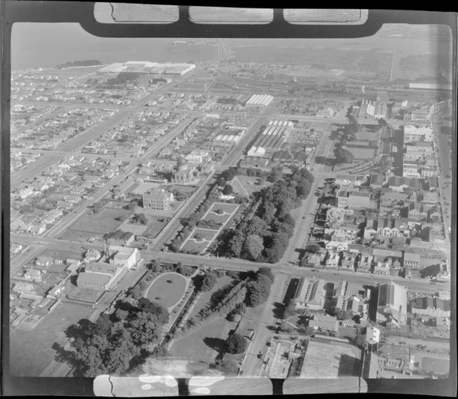 View southwest over downtown Invercargill City, with Otepuni Gardens in foreground and Tyne Road with Saint Mary's Basilica and railway yards beyond