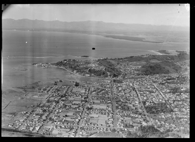 Nelson City and the hill suburb of Stepneyville with the Port of Nelson wharf and industrial area, with Tasman Bay and the Waimea Inlet beyond