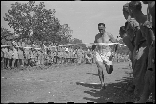 Major William Nicol Carson wins 440 yards race at 5 NZ Field Regiment Gymkhana, Arce, Italy, World War II - Photograph taken by George Bull