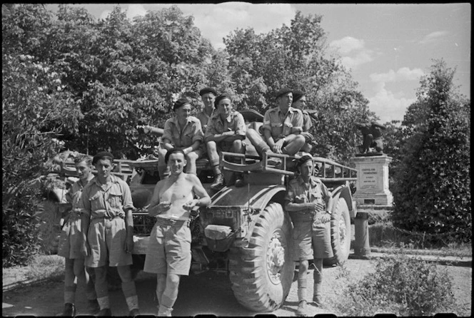 New Zealand Divisional Cavalry members and their Staghound in front line town of Castiglion Fiorentino, Italy, World War II - Photograph taken by George Kaye