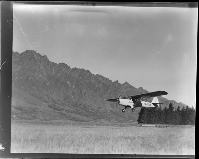 Aircraft ZK-AOB Auster J1B Aiglet, flying, Queenstown, Otago region