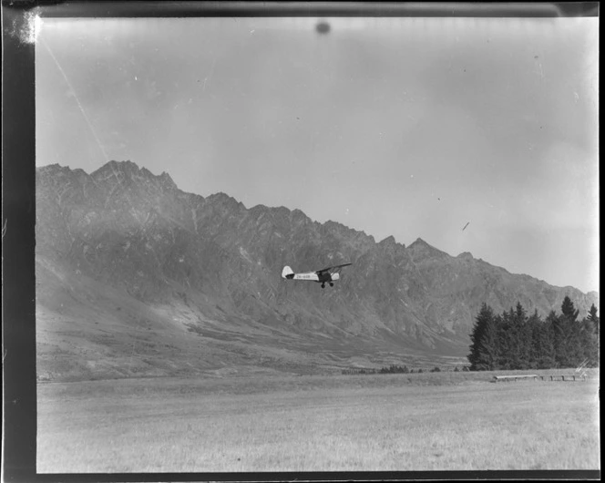 Aircraft ZK-AOB Auster J1B Aiglet, flying, Queenstown, Otago region