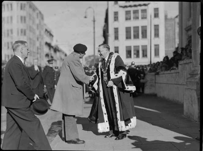 Honorable F Jones (left), Lord Montgomery shaking hands with Mayor of Wellington Mr W Appleton, at a parade, Wellington