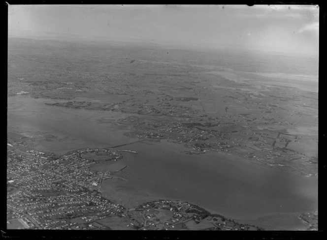 Suburban Bus Company Coverage, Onehunga in foreground with Gloucester Reserve, the Mangere Bridge and the Manukau Harbour to the suburb of Mangere beyond, Auckland City