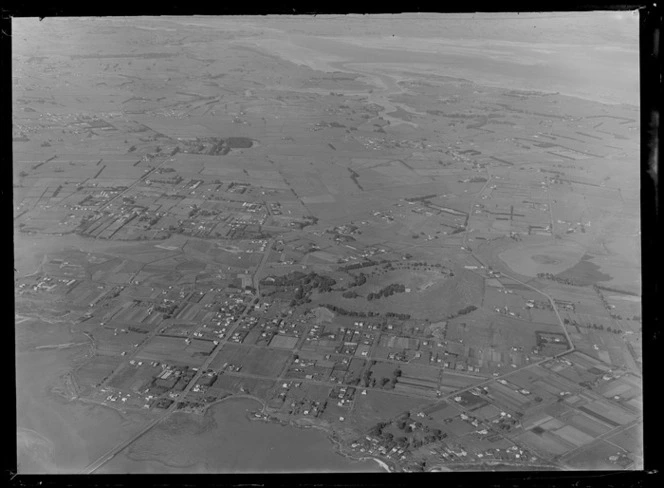 Suburban Bus Company Coverage, Mangere Bridge and Domain with the Manukau Harbour in foreground to the suburbs of Mangere and Papatoetoe surrounded by farmland, Auckland City