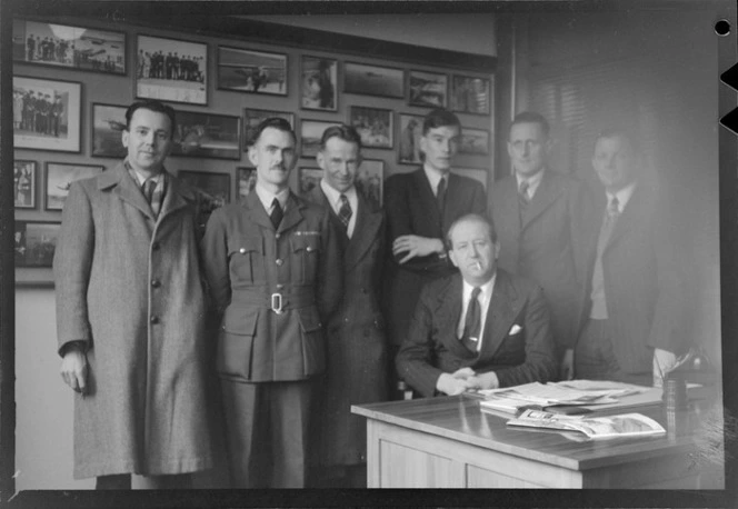 Unidentified members from the Bristol Freighter crew and Whites Aviation staff, in offices of Whites Aviation Ltd