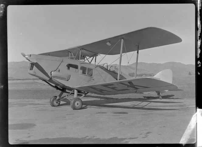 Bristol Freighter Tour, view of NZ NAC Fox Moth ZK-AEK passenger biplane on the runway, Omaka Airport, Blenheim, Marlborough Region