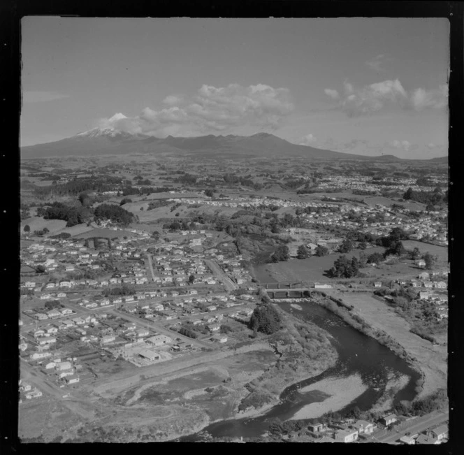 New Plymouth, Taranaki Region, including two bridges over [Waiwhakaiho?] river, suburban housing, and tennis courts