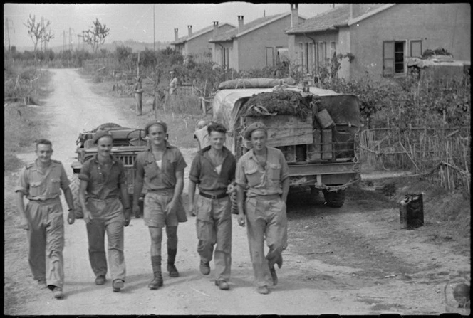 New Zealand artillery personnel walking into Riccione, Italy, during World War II - Photograph taken by George Kaye