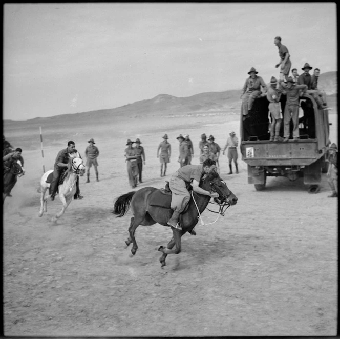 Horse race in progress at race meeting organised by 36 New Zealand Survey Battery in Trans Jordania, World War II - Photograph taken by M D Elias