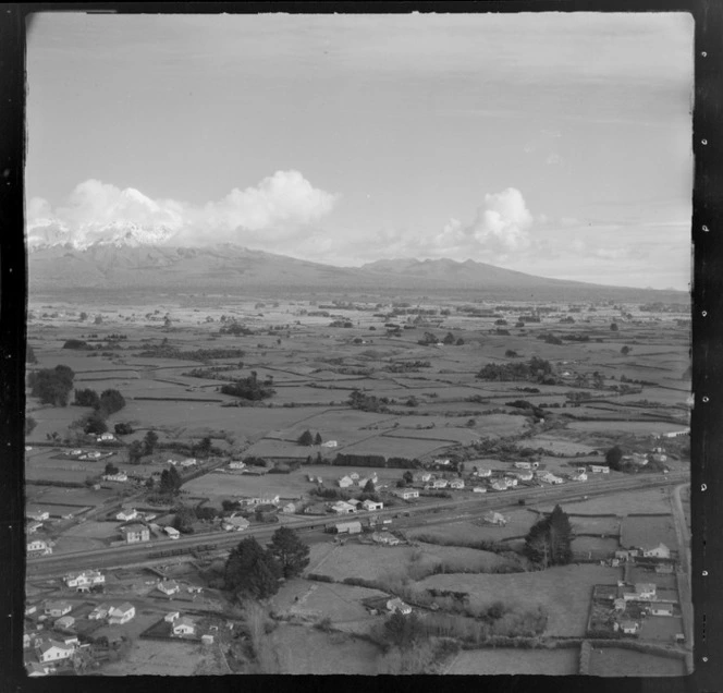 View over the farming settlement of Midhurst with railway station to farmland and Mount Taranaki beyond