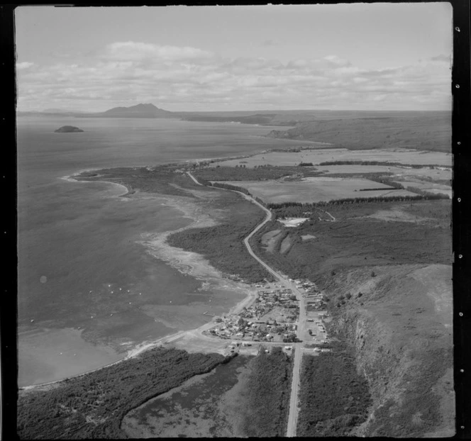 View of the eastern side of Lake Taupo with State Highway 1 and the settlement of Motuoapa to Motutaiko Island beyond