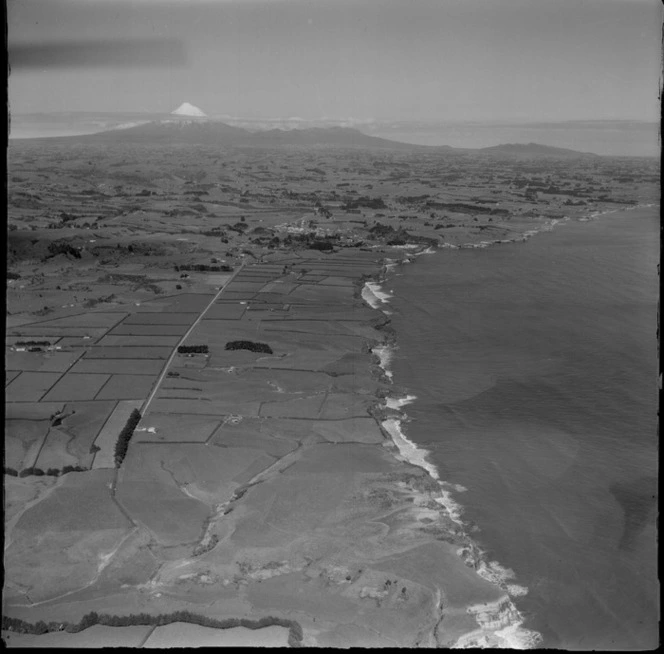 Views of the north New Plymouth coastline with the coastal settlement of Urenui to Mount Taranaki beyond, North Taranaki Region