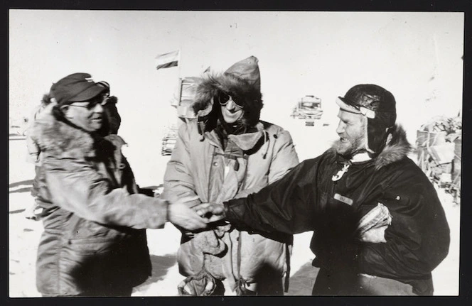 Admiral Dufek, Sir Edmund Hillary and Sir Vivian Fuchs greet each other at the South Pole