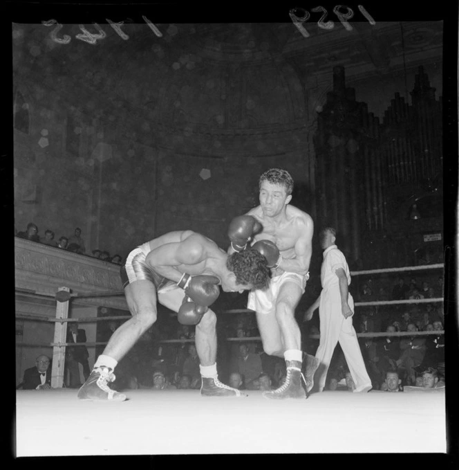 Boxing match, showing unidentified boxers and crowd, Wellington Town Hall