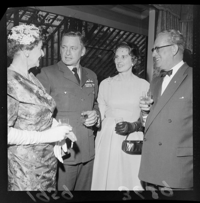 Group of unidentified guests at cocktail party, at UK High Commissioner's home for visiting airmen (Blue Domino)