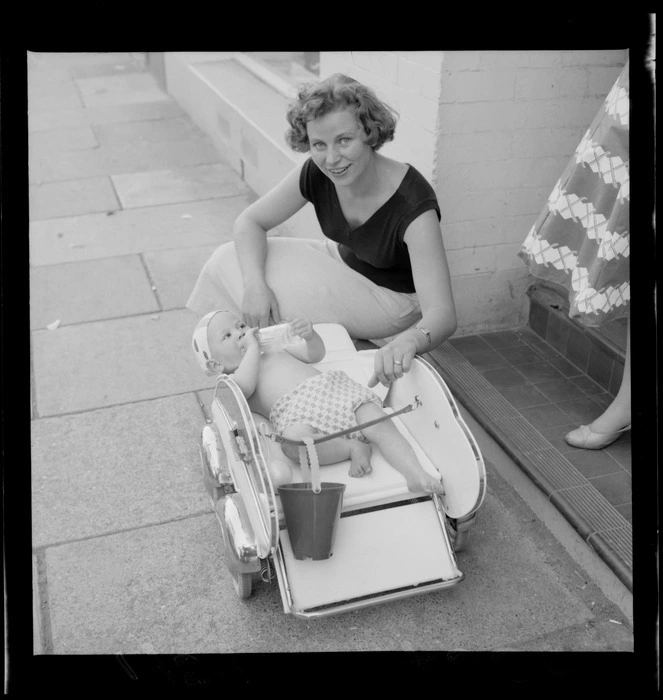 Mrs Belliss and her infant daughter in a pram