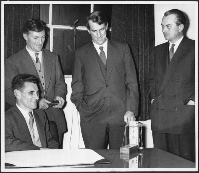 Sir Edmund Hillary and Mr J H Miller receiving IWC watches