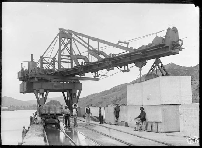 Scene with a steam crane during work on a breakwater, Gisborne