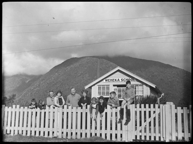 Teacher and pupils outside Weheka School