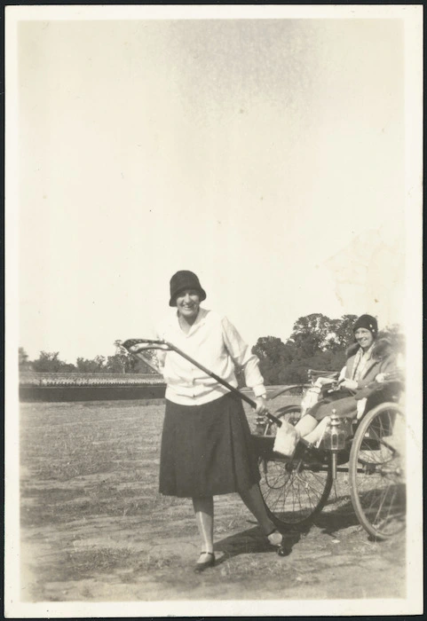 Agnes Moncrieff between the shafts of a rickshaw, China