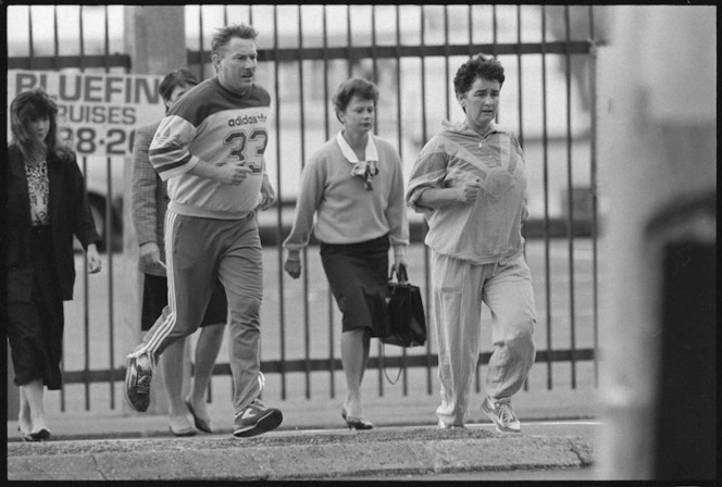 Finance minister Ruth Richardson jogging to work, accompanied by a member of the Diplomatic Protection Squad, Wellington